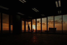 A person stands in a CoHive space in this promotional photo from 2019.