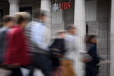 France fines Swiss bank UBS record 3.7 bn euros in tax fraud case