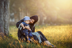 It takes no edict. Surge in piety gives rise to sharia-inclined society in Indonesia.