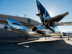 In this image courtesy of Virgin Galactic, SpaceShipTwo mates to the mothership, WhiteKnightTwo, at Mojave Space Port on Feb. 19, 2019, in Mojave, California.Space tourism company Virgin Galactic on Monday announced a partnership with engine-maker Rolls-Royce to build a supersonic commercial airplane that flies at three times the speed of sound.