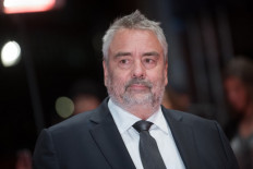 French director Luc Besson poses on the red carpet upon arrival for the premiere of the film 'Eva' presented in competition during the 68th Berlinale film festival on February 17, 2018 in Berlin. 