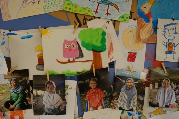 Photos of children from Kampung Melayu, East Jakarta, who joined a three-month intensive workshop prior to the 'Krayon Kami Karya Kami' exhibition.