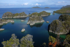 Small islands are seen in Raja Ampat, West Papua, a popular tourist site renowned for pristine waters. 
