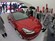 Cars, a cocktail and a celebrity: South Koreans succumb to Tesla fever
