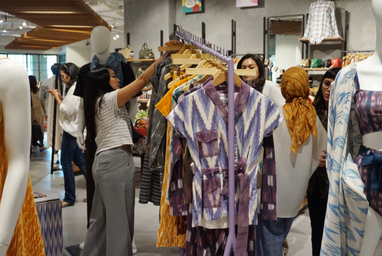 Shopping pattern: People browse outfits during the launch of Ikat Indonesia at The Goods Dept. on March 1 at Pacific Place, South Jakarta. 