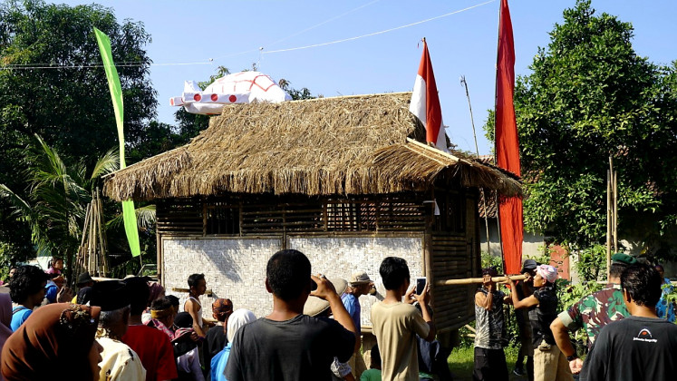 Reclaiming their village: The Gotong Rumah art performance is a way for Wates’ villagers to protest the takeover of their land by the Indonesian Air Force.