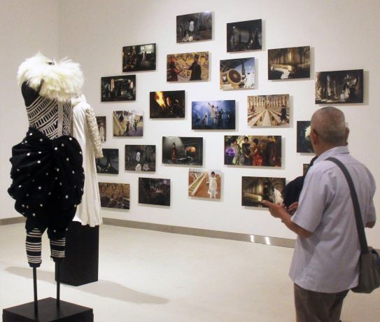 Collage: The exhibition features 32 photographs alongside costumes made by Dutch designer Rien Bekkers. 