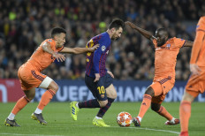 Messi proves too much for Lyon as Barcelona reach Champions League quarters