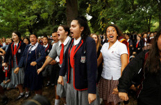 New Zealand begins funerals for mosque shooting victims, PM visits school