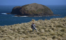 This photo taken on February 24, 2019 shows Mike Buckby from the Cape Grim Water Company posing in Cape Grim, Tasmania. 