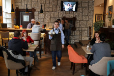 Disabled Serbian waiters fight discrimination with free drinks and good service
