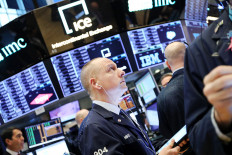 Traders work on the floor of the New York Stock Exchange in New York City, US, in this undated photo.