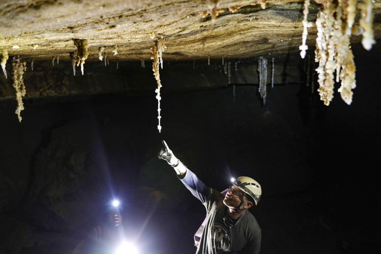 Yoav Negev, chairman of the Israel Cave Explorers Club and project leader of the Malham Cave Mapping Expedition, shows journalists salt stalactites in the Malham cave inside Mount Sodom, located at the southern part of the Dead Sea in Israel on March 27, 2019. (AFP/Menahem Kahana).
Usage: 0