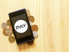 Japan slowly buying into cashless future despite widespread misgivings