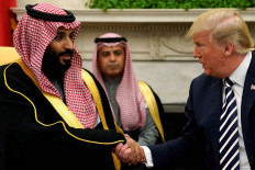 U.S. President Donald Trump shakes hands with Saudi Arabia's Crown Prince Mohammed bin Salman in the Oval Office at the White House in Washington, U.S. March 20, 2018. 