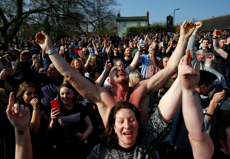 Fans gather for British singer Keith Flint of techno group The Prodigy funeral in Braintree, Essex, Britain, March 29, 2019.