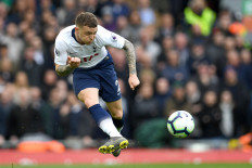 In style: Tottenham Hotspur defender Kieran Trippier passes the ball during the English Premier League soccer match between Liverpool and Tottenham Hotspur at Anfield in Liverpool, northwest England on Sunday. 