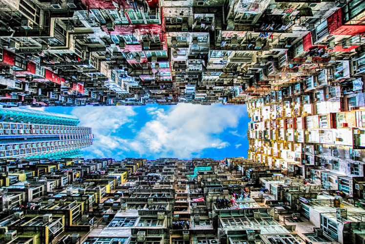 A vertical view of Montane Mansion reveals blocks of balconies that stretch to the skies above Quarry Bay, Hong Kong.