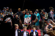 King Paku Buwono XIII is lifted on his wheelchair to the horse carriage to proceed with the great march. JP/Maksum Nur Fauzan