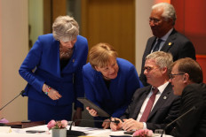 EU gives Britain six-month delay to Brexit date