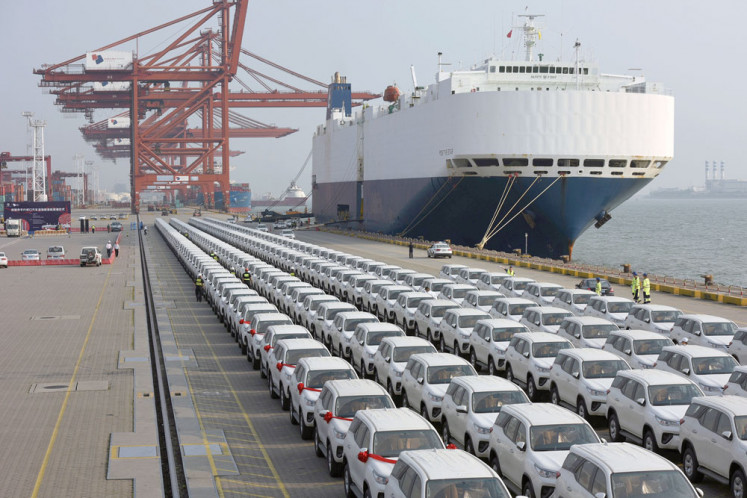 Imported Toyota cars are parked on a dock on Wednesday after they were unloaded from a cargo vessel at the DaChan Bay Terminals in Shenzhen, China.