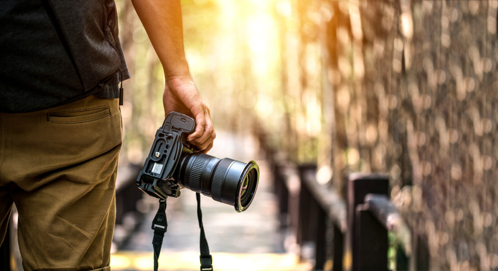 Photo of Person Holding Black Camera · Free Stock Photo