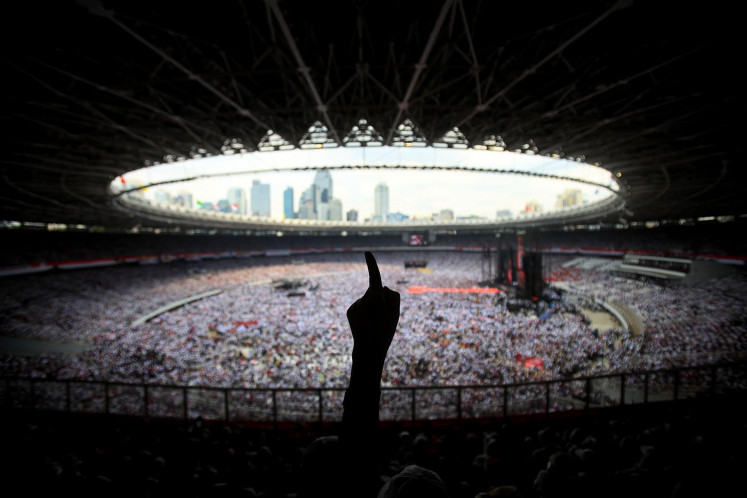 Supporters of President Joko “Jokowi” Widodo attend the incumbent’s final and largest open-air campaign rally at the Gelora Bung Karno Stadium in Jakarta on Saturday.