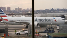 In this file photo taken on March 13, 2019 an American Airlines 737 Max sits at the gate at LaGuardia airport in New York. 