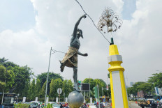Once nude Hermes statue now covered in old cloth