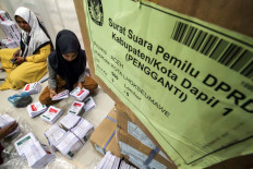 Freelance workers sort and fold substitute and additional ballots at the Lhokseumawe Independent Elections Commission (KIP) in Aceh on Friday. The local KIP received 5,912 substitute and additional ballots for the simultaneous elections. Antara/Rahmad