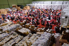 Temanggung General Elections Committee (KPUD) workers fold ballots for the 2019 elections at the Bambu Runcing sports hall in Temanggung, Central Java, on April 1. As many as 350 residents were employed to prepare the materials. 