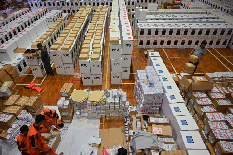 Officials prepare ballot boxes and other voting materials in Jakarta ahead of the 2019 presidential and legislative elections.