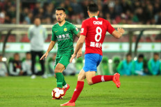 East to east: Nico Yennaris (left), also known as Li Ke, of Beijing Guoan faces off with Henan Jianye during a Chinese Super League match in BeijingSome players have brought their own pillows and one even has a box of Lego as the much-delayed Chinese Super League prepares to launch on Saturday in a tightly controlled environment to thwart the coronavirus.