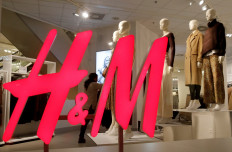 The logo of H&M is seen in a display window of a store in Zurich, Switzerland January 7, 2019. 