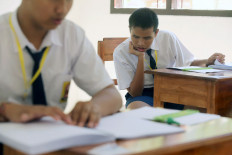 Heavy focus: Students take the national exam on Monday at a school for the disabled (SLB) in Denpasar, Bali. The exam was held at junior high schools throughout the country from Monday to Thursday.