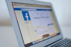 Thai activist charged over 'inappropriate' royal history post