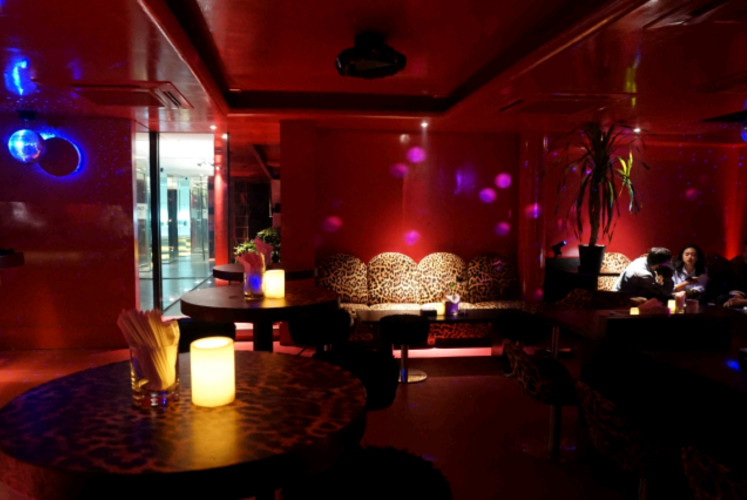 The interior of Zodiac combines hot pink walls with specially designed, leopard-printed sofas. 