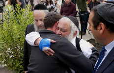 Rabbi wounded in US synagogue shooting says Jews won't be cowed