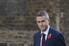 UK's May sacks defence minister Williamson over Huawei leak