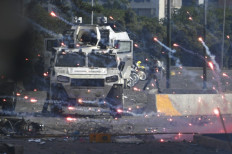 One shot dead, at least 27 hurt in Venezuela May Day clashes