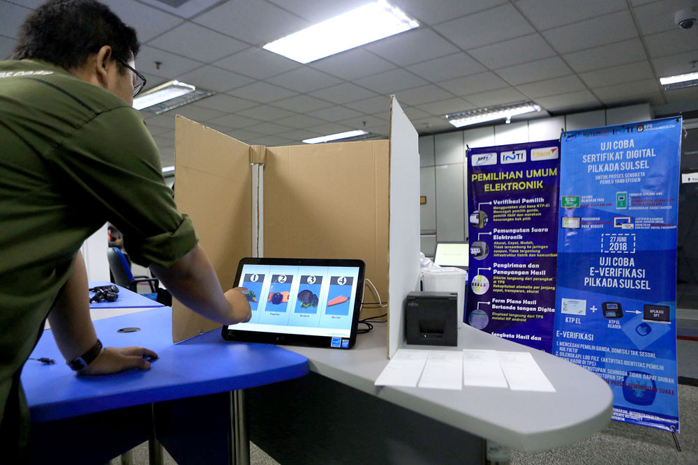 Going digital: An Agency for the Assessment and Application of Technology official demonstrates the e-voting system in Jakarta on May 5, 2019. 