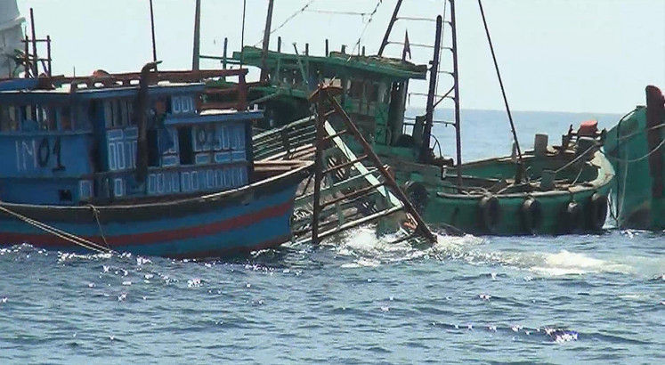Indonesia sinks scores of boats to deter illegal fishing