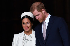 In this file photo taken on March 11, 2019 Britain's Prince Harry, Duke of Sussex and Meghan, Duchess of Sussex leave after attending a Commonwealth Day Service at Westminster Abbey in central London. 