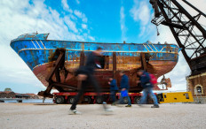 The fishing vessel 'Barca Nostra' (Our Ship) that sank on April 18, 2015 trapping hundreds of migrants in its hull, is being installed in Venice's former shipyards as part of the centerpiece of a new art project by Swiss-Icelandic artist Christoph Buechel, prior to the the 58th International Art Exhibition of the Venice Biennale, on May 7, 2019 in Venice. 