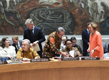 United Nations Secretary-General António Guterres (second left, seated) donned a 'tenun' shirt at the Indonesia-chaired UNSC meeting on May 7, 2019 in New York, the United States.