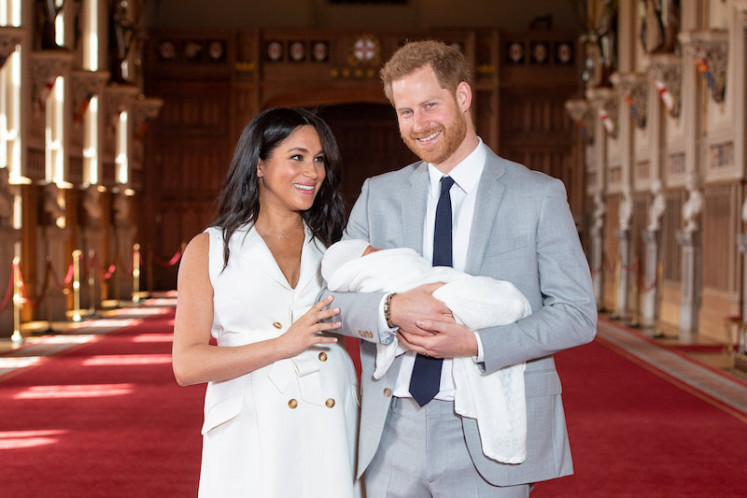 Britain's Prince Harry and Meghan, Duchess of Sussex are seen with their baby son, who was born on Monday morning, during a photocall in St George's Hall at Windsor Castle, in Berkshire, Britain, on May 8, 2019. 