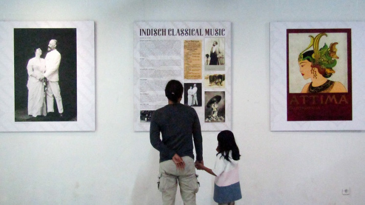 Musical blend: Visitors are reading information panels on indisch, a genre with classical Western and traditional Indonesian music influences.  