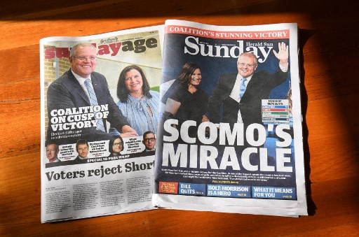 This photo illustration taken on May 19, 2019 show Sunday newspapers in Melbourne displaying the victory of Australia's coalition government after they clung to power in a general election they were expected to lose. Australia's ruling conservative coalition defied expectations to retain power in national elections on May 18, prompting Prime Minister Scott Morrison to declare: 