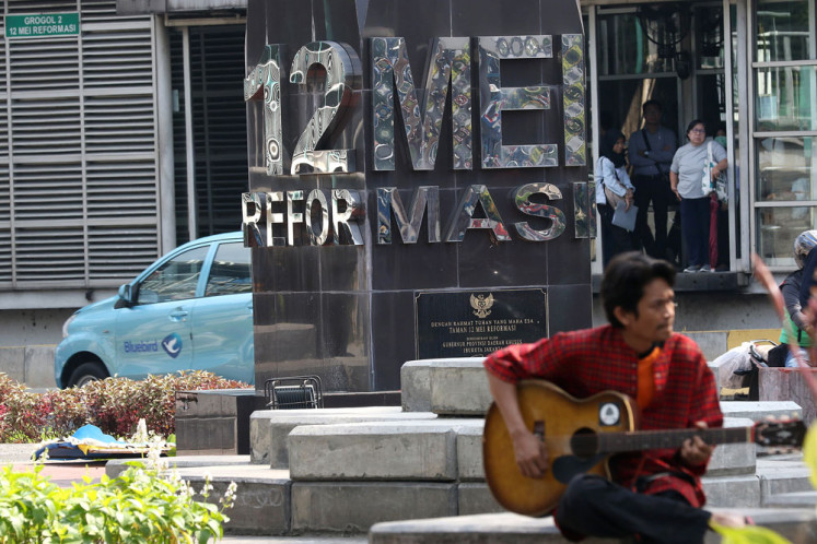 Still fresh in our memory: A man plays a guitar in the May 12 Reform Park in Grogol, West Jakarta, on May 13. The park was built to pay respects to four Trisakti University students who were killed during a mass demonstration to fight for reforms in May 1998.