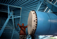 A mosque official hits the giant drum prior to the adzan (call to prayer). JP/Boy T. Harjanto